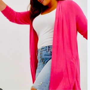 Torrid super soft knit fabric cardigan with pockets. Never worn but tags removed
